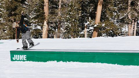 kid hitting a rail in terrain park