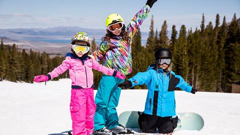 three girls posing in snowboard gear